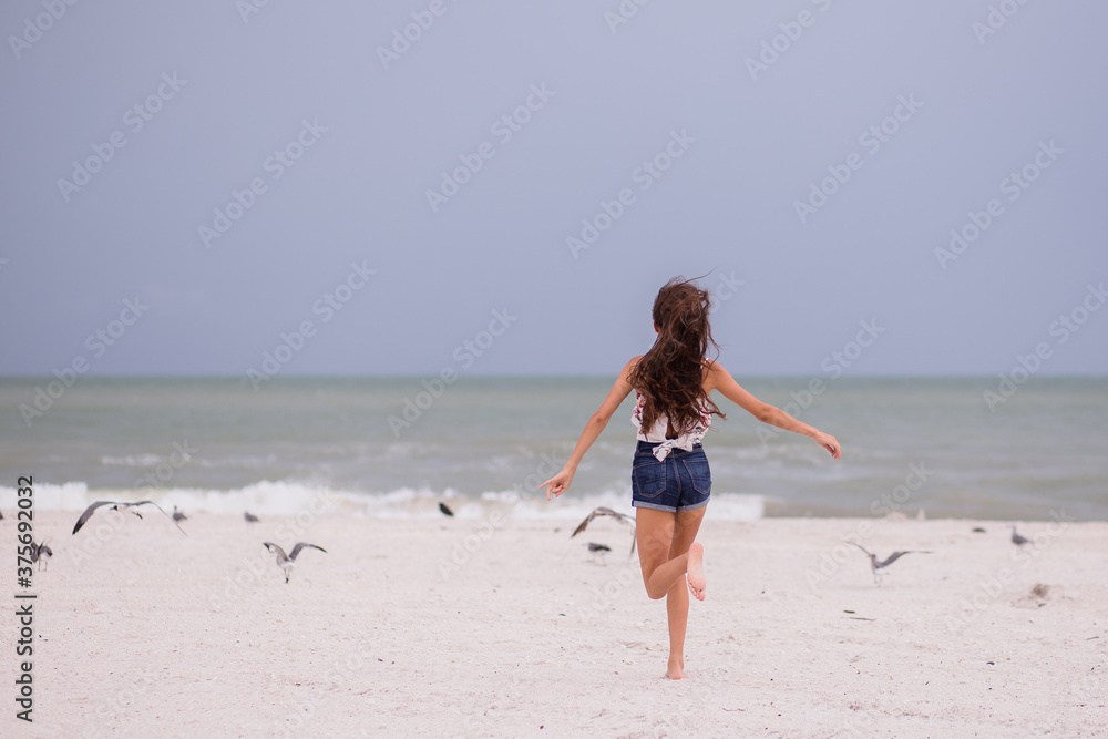 Girl running on the beach in Marco Island
Girl running on the beach in Marco Island