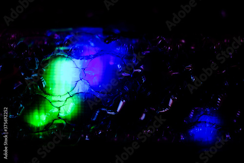 Fototapeta Naklejka Na Ścianę i Meble -  abstract background created with a colorful image through a sheet of plastic bubble wrap