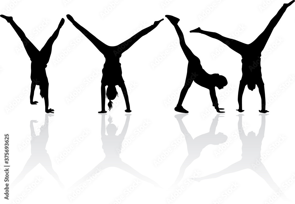 Fototapeta premium Silhouette of agile young man doing a handstand.