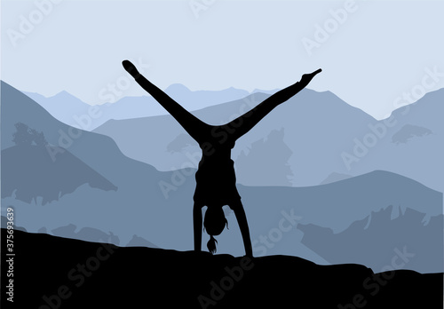 Yoga exercises, silhouette of a girl practicing.