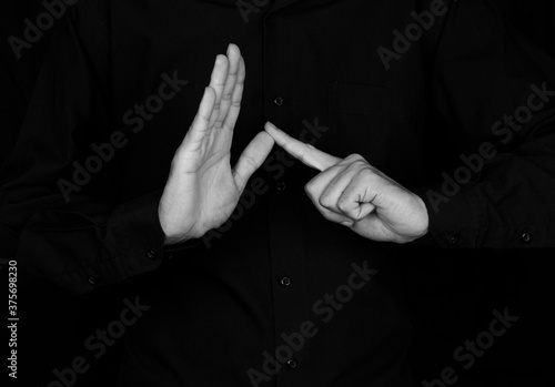 mannequin and black and white photography demonstrating sign language using hands