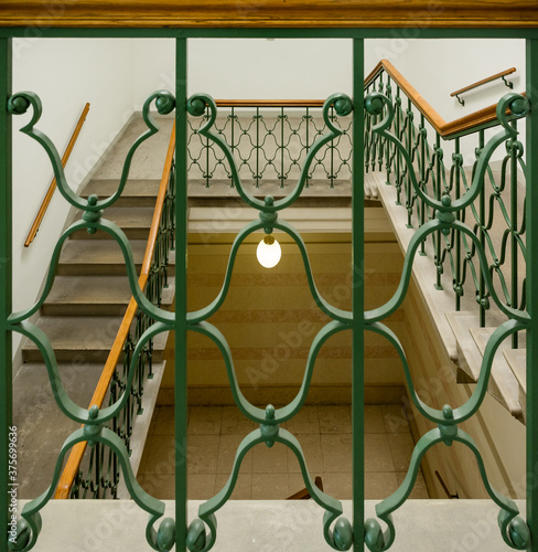 spiral staircase with green reiling photo