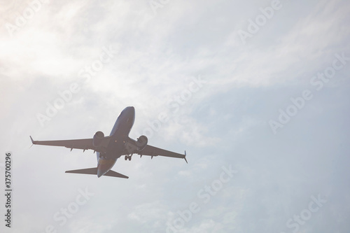 Close up shot of an airplane flying in the sky