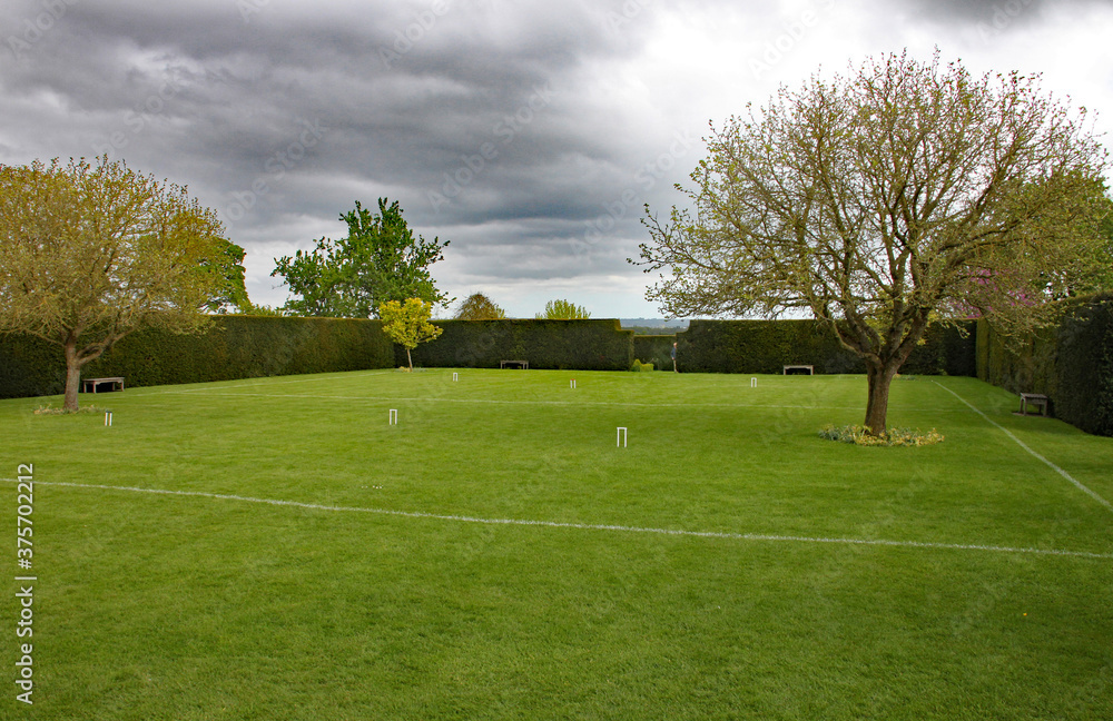 Croquet lawn set up ready for a game in an English country garden