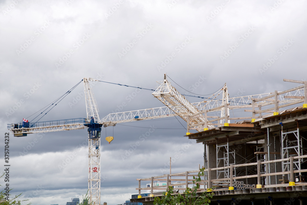 Cranes over the condominium construction site, Toronto, Ontario, Canada.