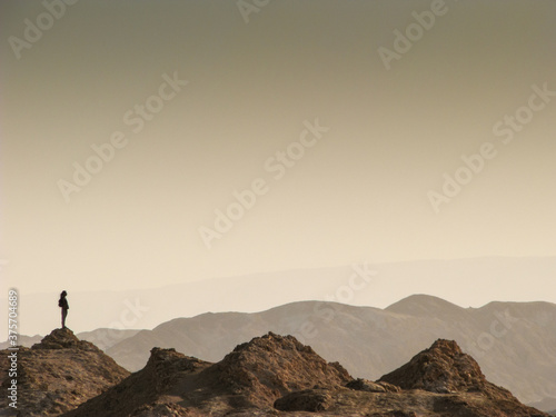 Lady Silhouette on the Top of a mountain photo