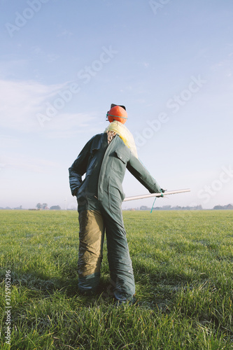Scarecrow with ballhead and overalls photo