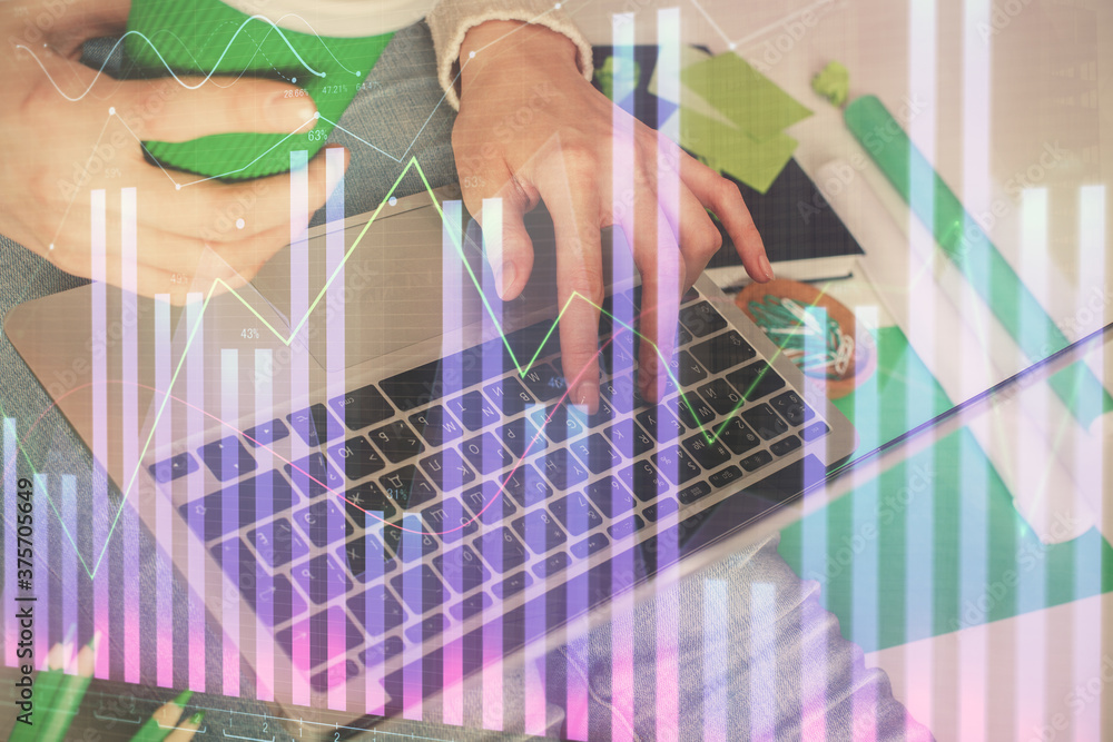 Double exposure of woman hands typing on computer and forex chart hologram drawing. Stock market invest concept.