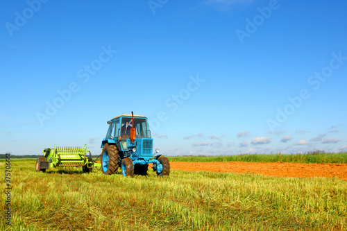 Tractor in a farmer's field. Agroindustrial production. Harvest season