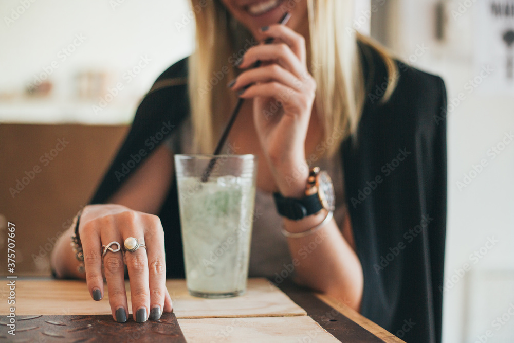 Woman drinking ice lemonade Woman drinking ice lemonade