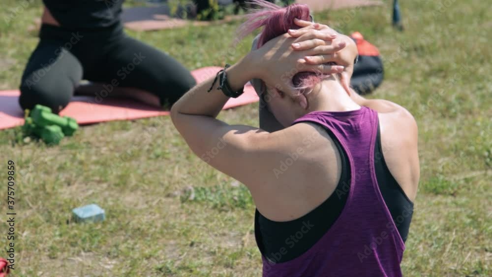 Women stretching yourself after doing exercises Women stretching yourself after doing exercises