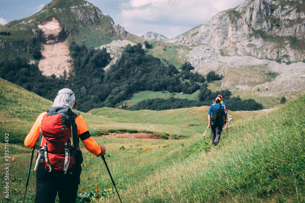 Hikers hiking in nature Hikers hiking in nature