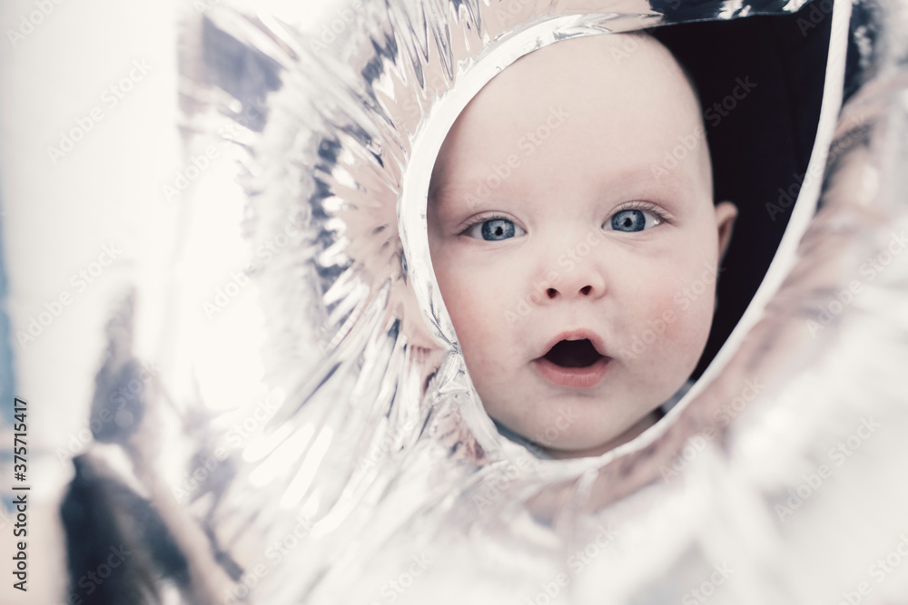 Curious funny baby with balloons Curious funny baby with balloons