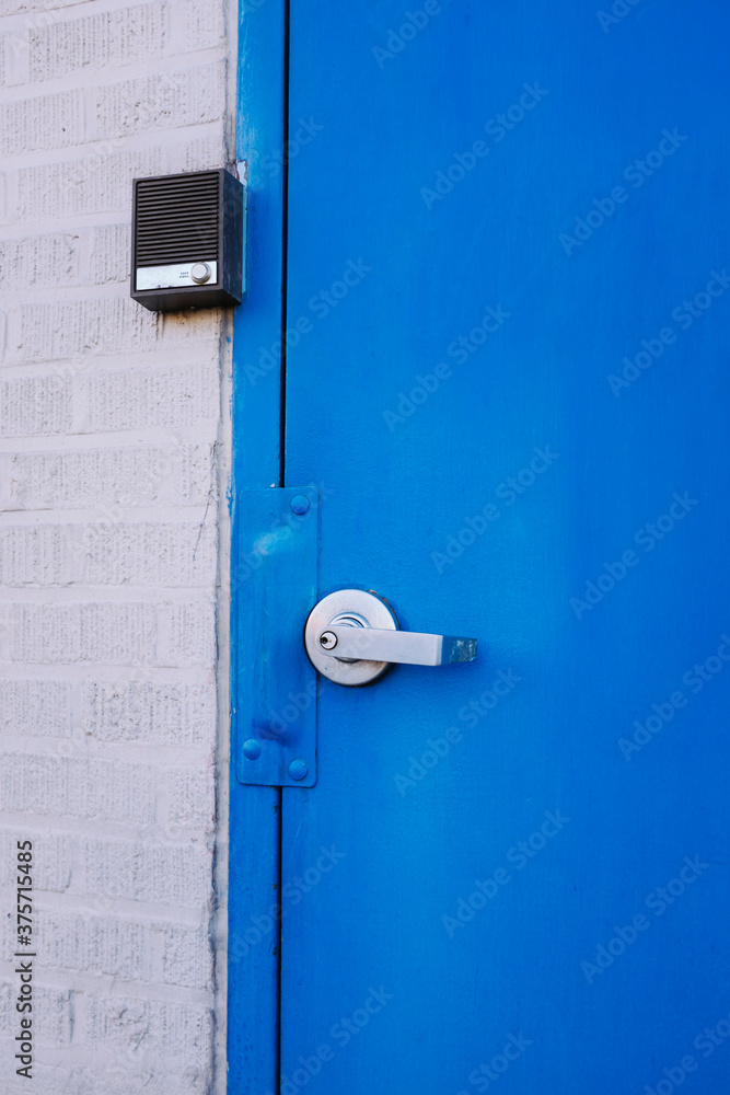 Blue door and intercom box Blue door and intercom box