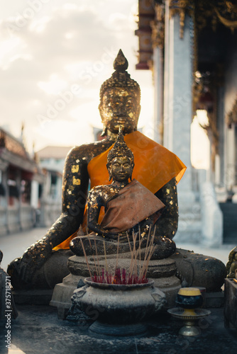 Buddha Statues in Wat Hua Lampong at Sunset photo