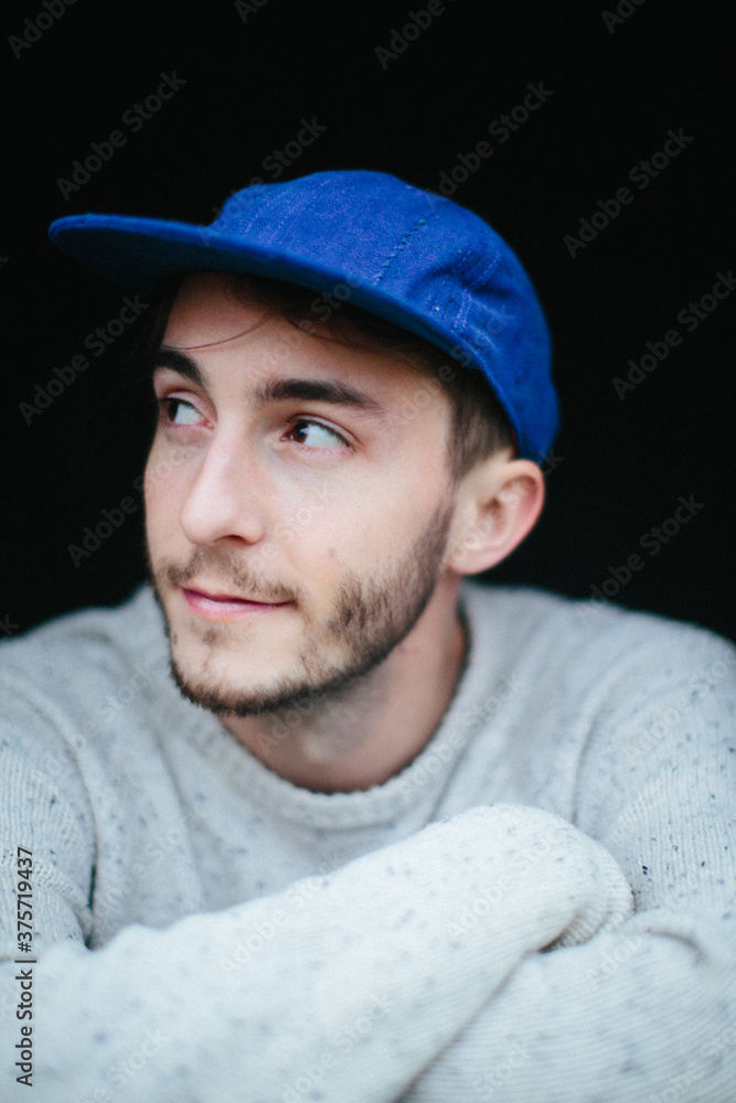 Portrait of a young man in a blue hat Portrait of a young man in a blue hat