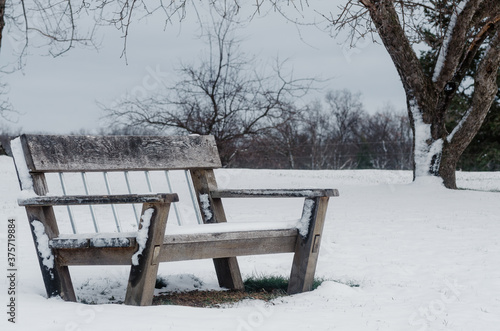 empty snow-covered bench