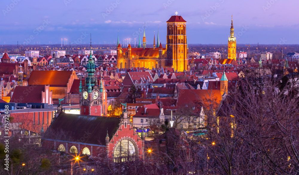 Obraz Aerial view of the Saint Mary Church and City Hall at night in Gdansk, Poland
