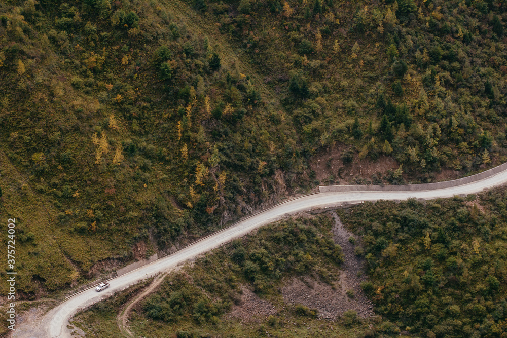 car running on the mountain road in Tibet car running on the mountain road in Tibet