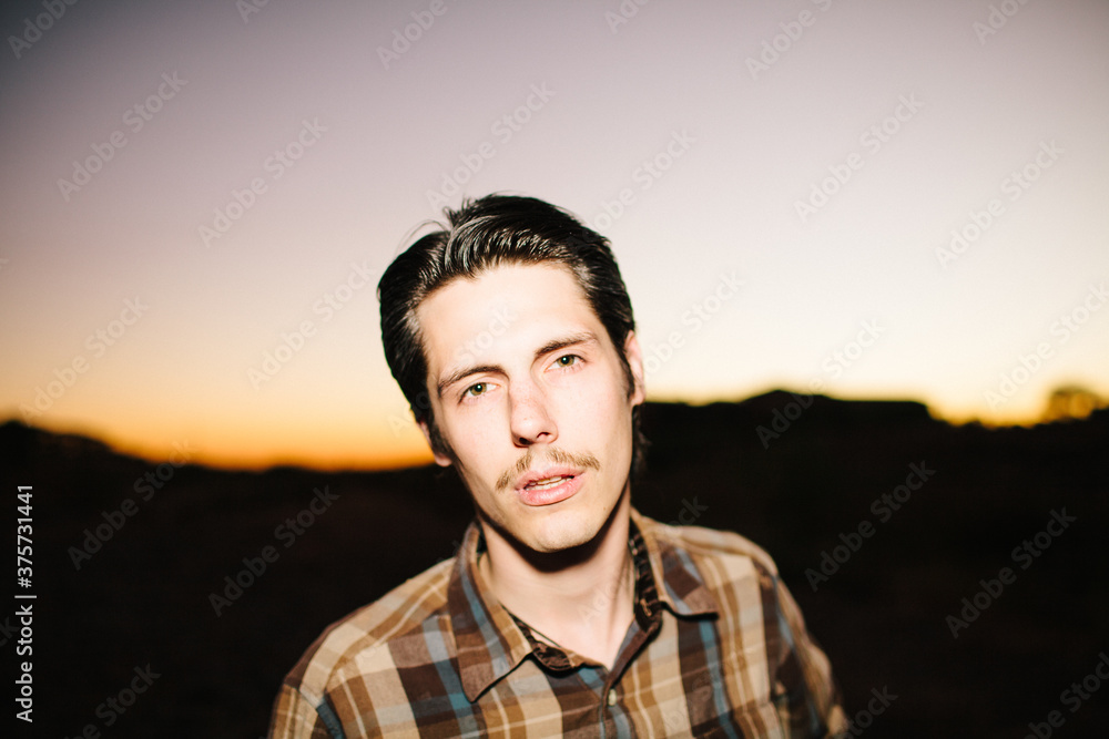 Young man at sundown Young man at sundown