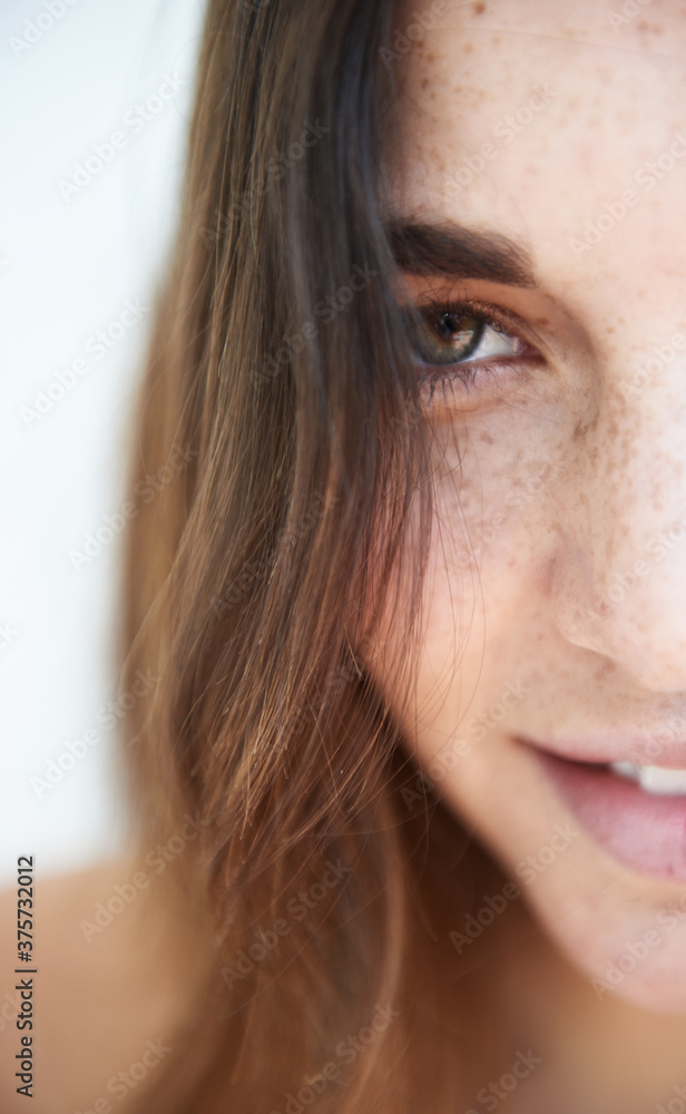 half portrait of a beautiful freckled woman half portrait of a beautiful freckled woman