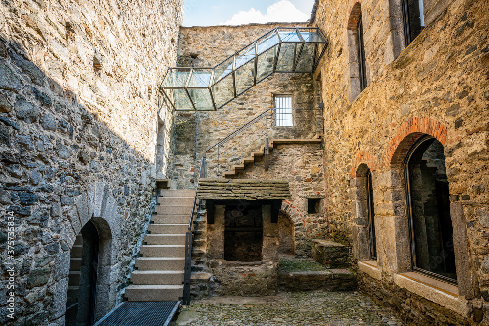 Courtyard and entrance of museum in middle of Montebello castle church in Bellinzona Switzerland