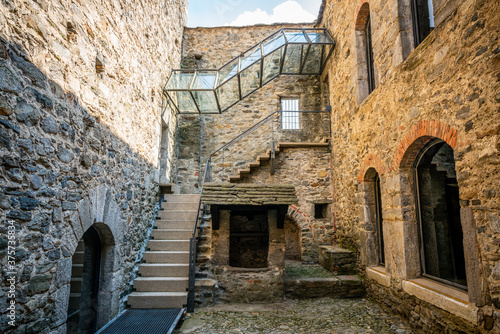 Fototapeta Naklejka Na Ścianę i Meble -  Courtyard and entrance of museum in middle of Montebello castle church in Bellinzona Switzerland