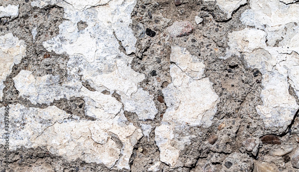 Background, texture, rough concrete wall, with cracks and holes. Background, texture, rough concrete wall, with cracks and holes.
