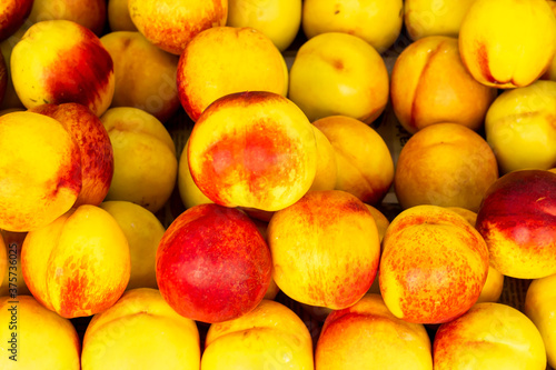 Natural ripe peaches background close up taken