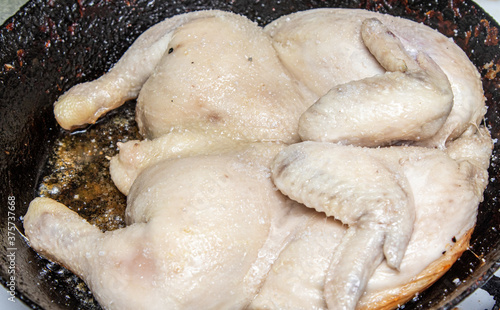 Fried chicken in a pan, close-up.