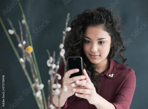 Young women taking photo with cell phone. photo