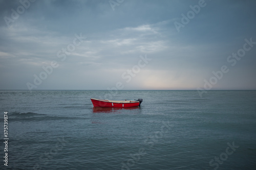 Lonely red boat photo