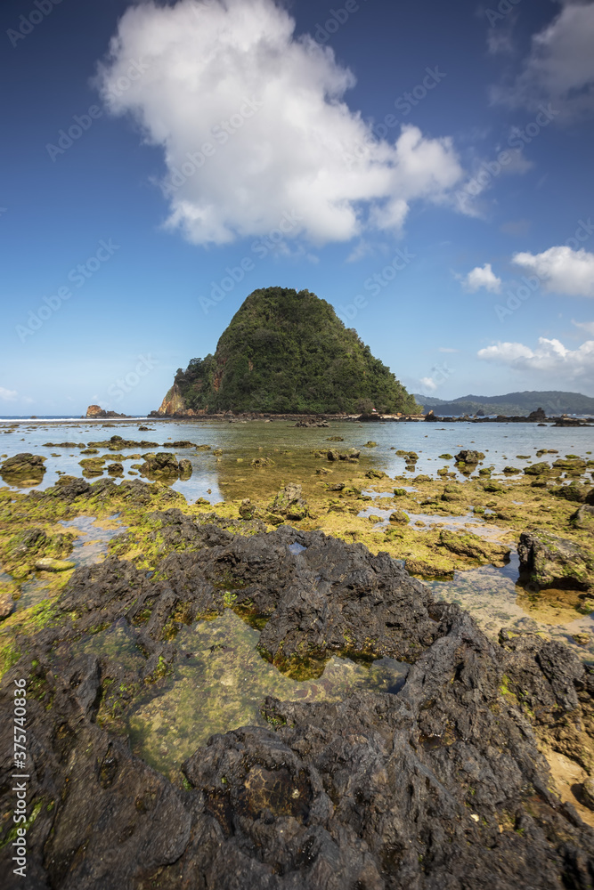 View of Red island beach in Banyuwangi in Indonesia. Java popular travel destination. Summer holiday background. View of Red island beach in Banyuwangi in Indonesia. Java popular travel destination. Summer holiday background.
