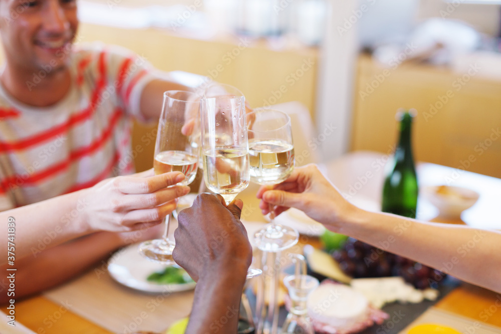 Group of friends making a toast with their wine glasses on a yacht. Group of friends making a toast with their wine glasses on a yacht.