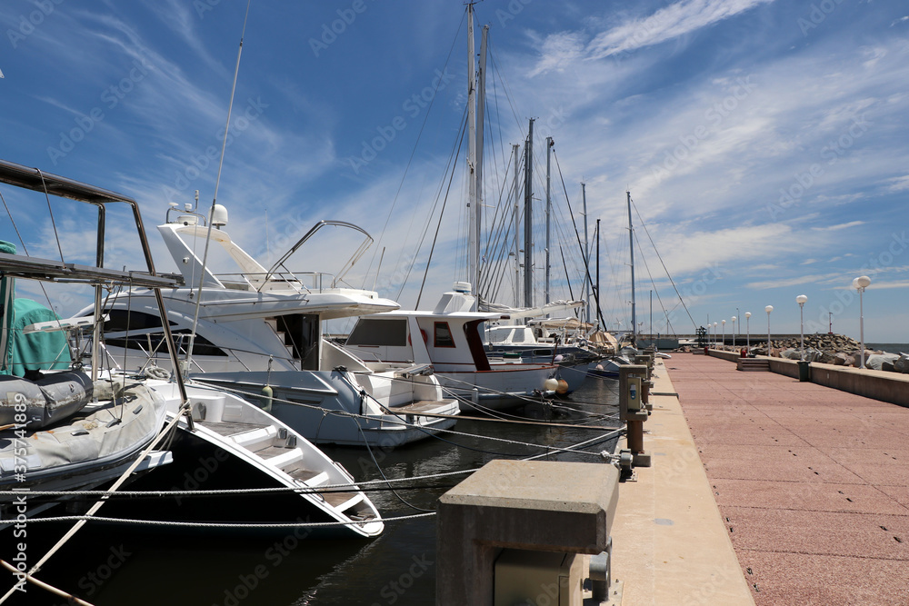 Fototapeta premium Boats moored at the yacht club pier