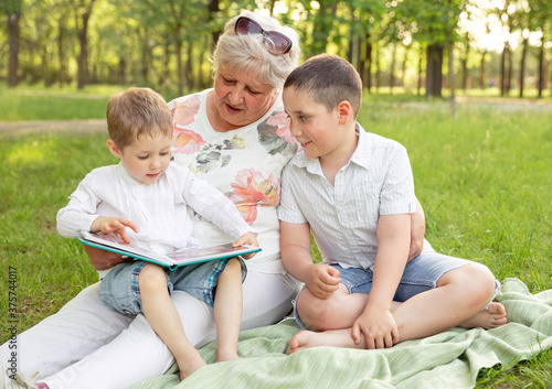 Granny with grandsons enjoying time together. Leisure activity, family © elenbessonova