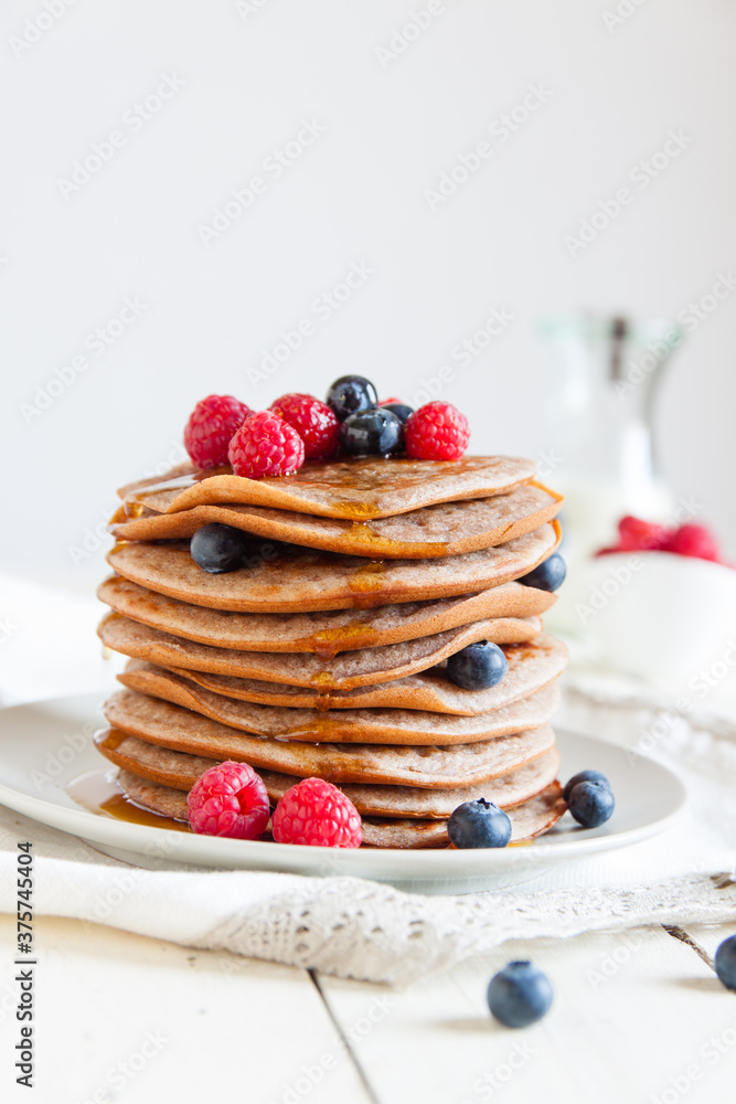 Fresh pancakes with blackberries, raspberries and maple syrup Fresh pancakes with blackberries, raspberries and maple syrup