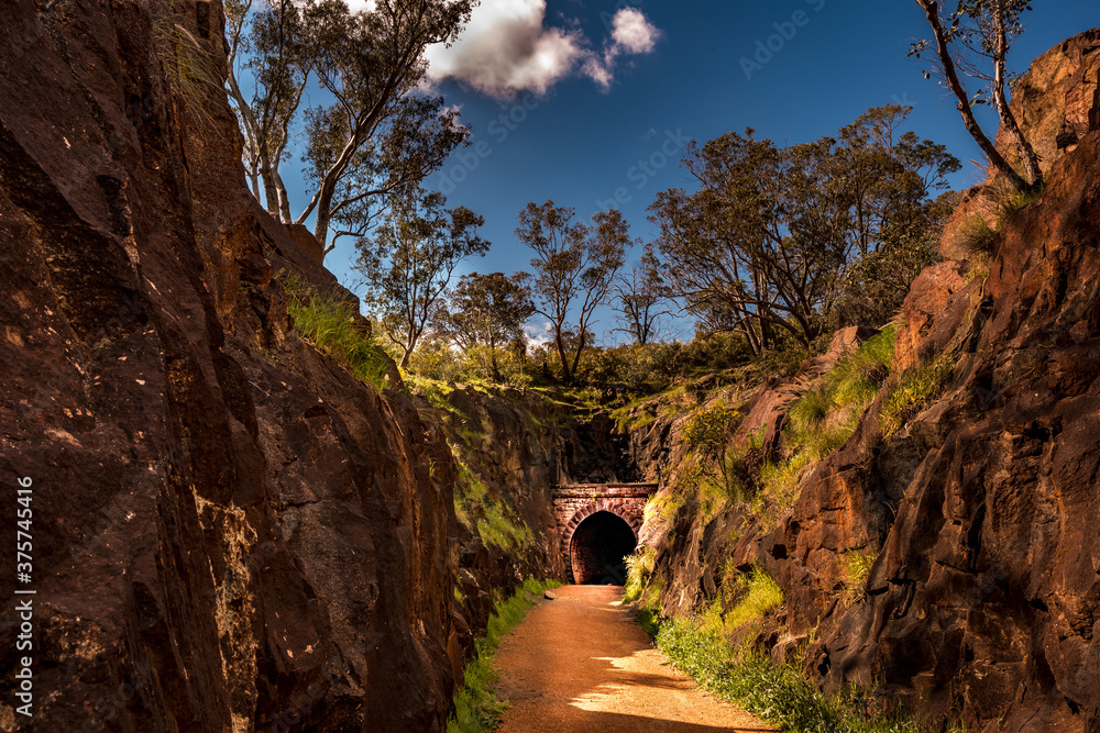 Road to the Hidden old train tunnel at national park with rock formation valley
