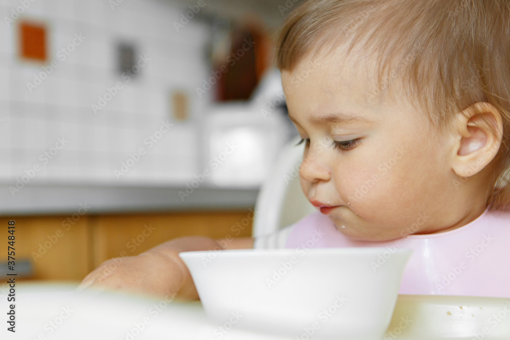 portrait of a child who smeared face with food