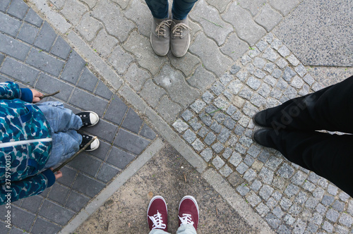 Group of four people on the street, personal perspective photo