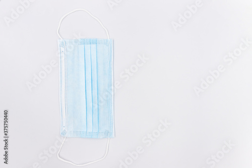 Blue medical face masks prevent dust and coronavirus  COVID-19  isolated on white.