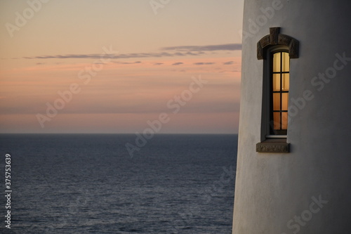 Lighthouse window at sunset.