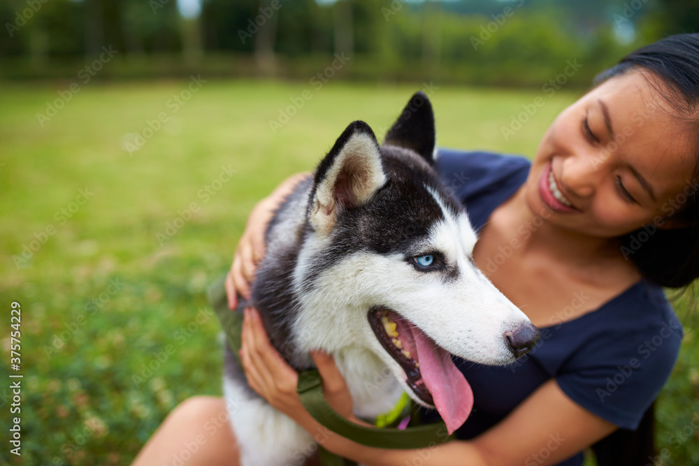 pretty young asian woman with her dog outdoor pretty young asian woman with her dog outdoor