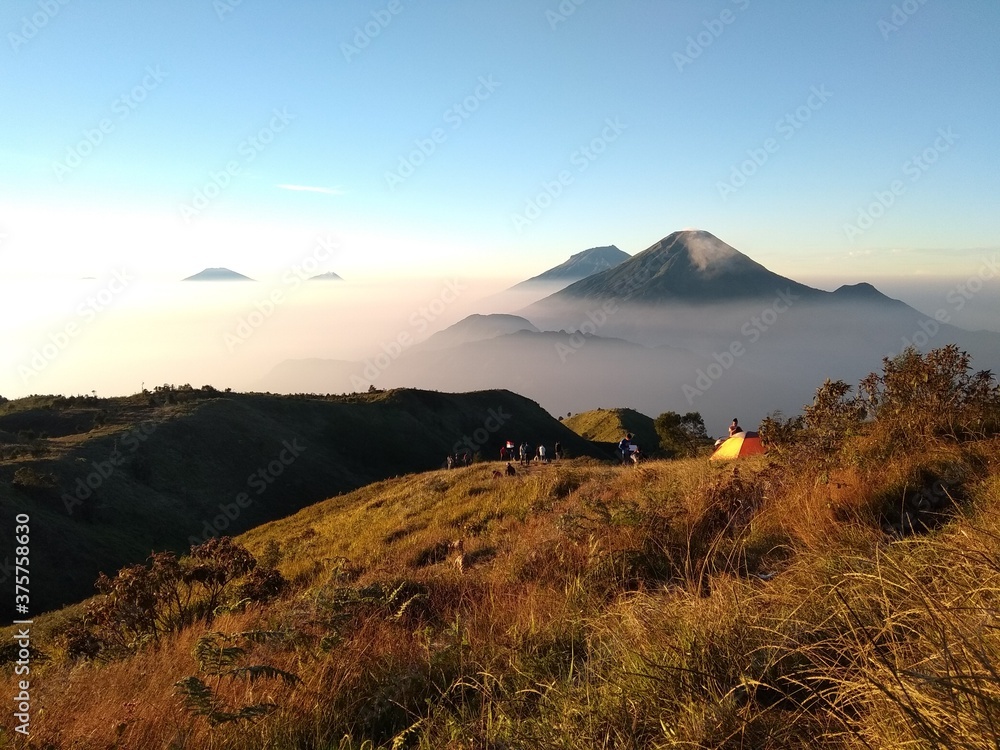 mountains under mist in the morning in prau indonesia