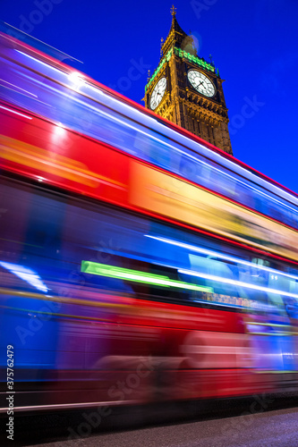 The Night Bus in London passing in front of the Big Ben photo