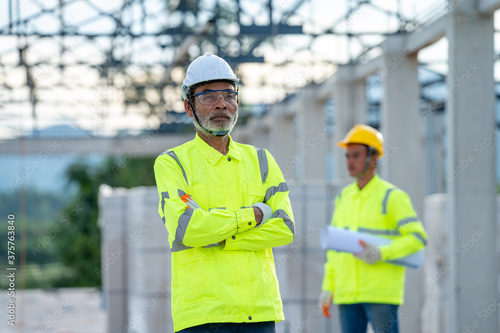 Construction manager and engineer working on construction site. Construction manager and engineer working on construction site.