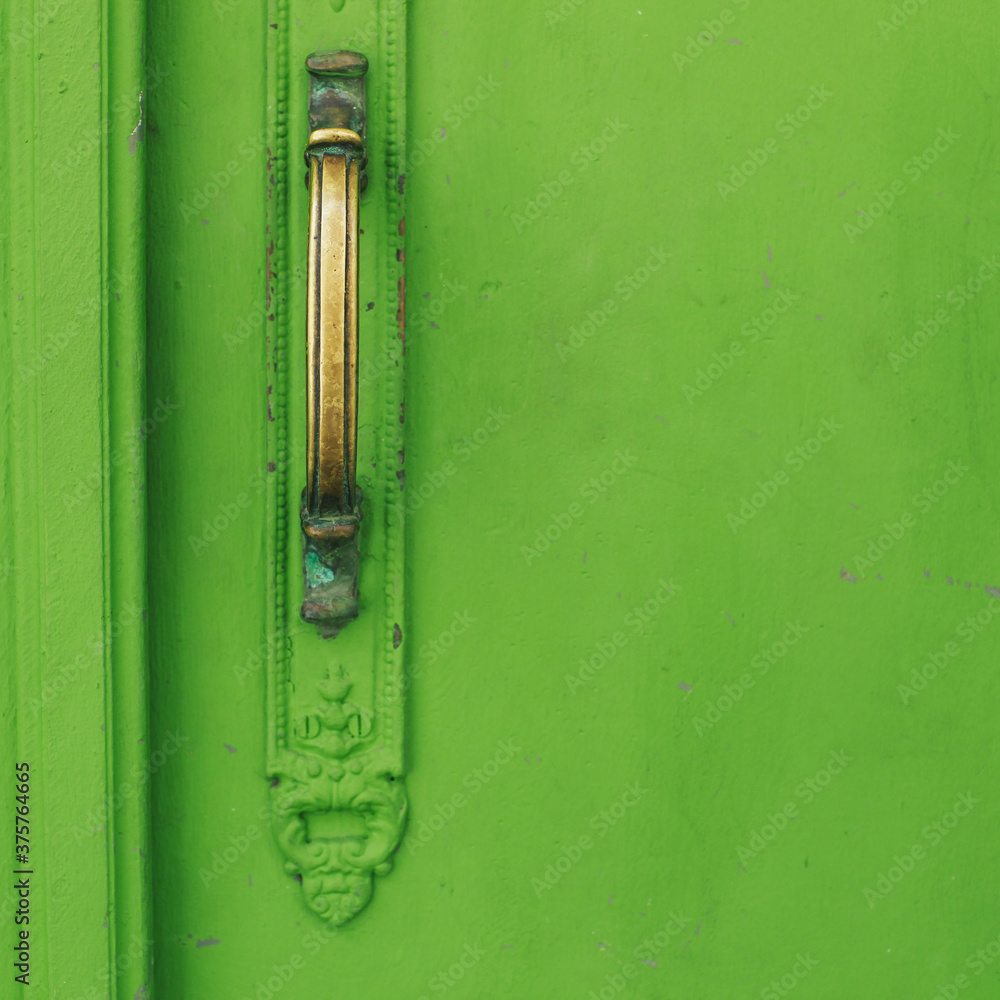 detail of an old door painted green detail of an old door painted green