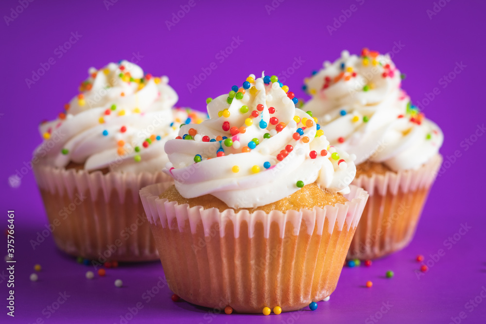 cupcake with white frosting and sprinkles cupcake with white frosting and sprinkles