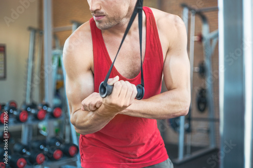 Close up of a young athletic man working out photo