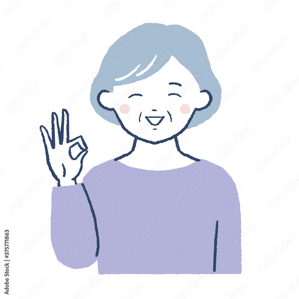 笑顔でOKポーズをするシニア女性 笑顔でOKポーズをするシニア女性